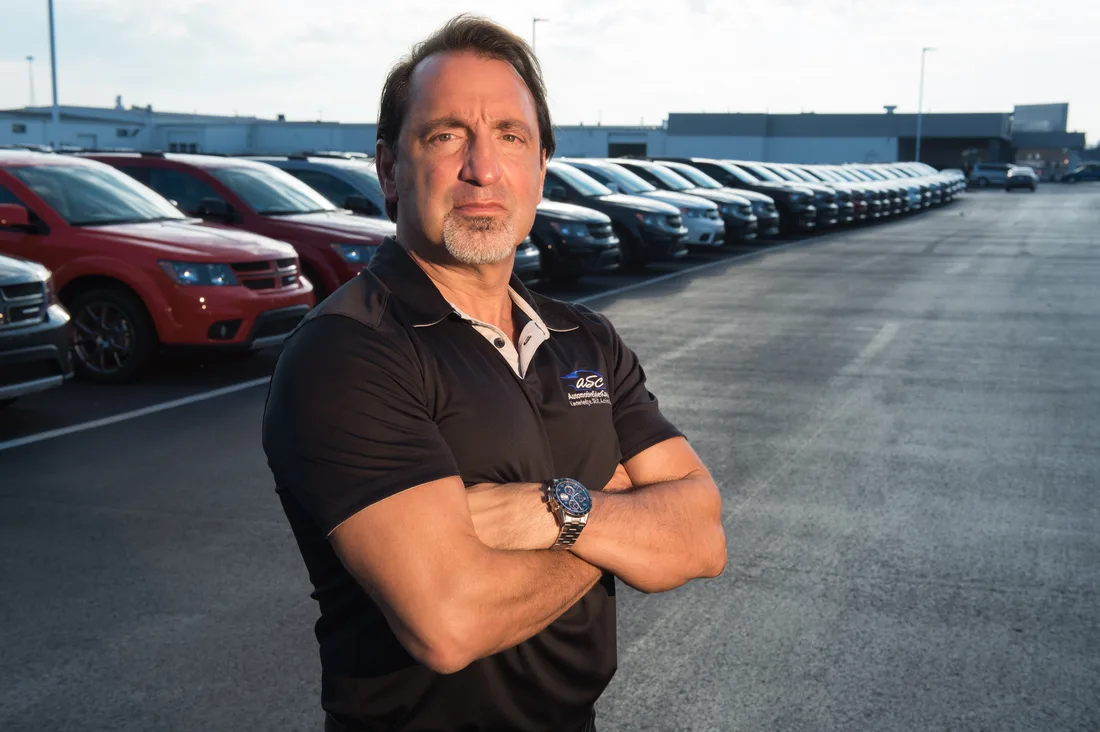 David Lowe, founder of Automotive Sales Coach, standing on a dealership lot